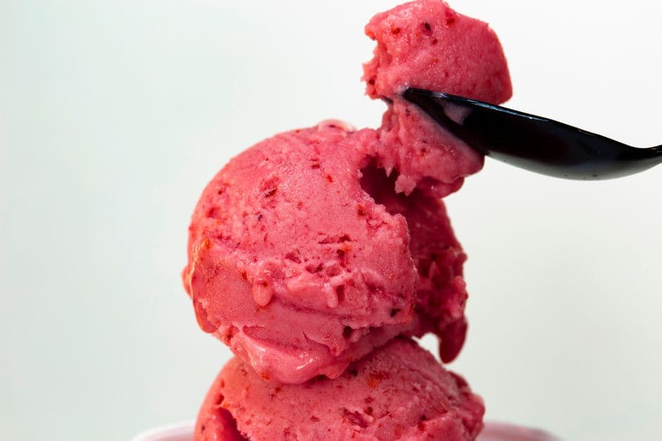 scoop of strawberry sorbet with berries